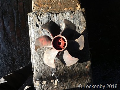 The bow thruster prop out in the sunlight